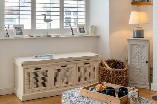 a room with a table with a box of food at 2 Bed in Mumbles oc-t42823 in The Mumbles