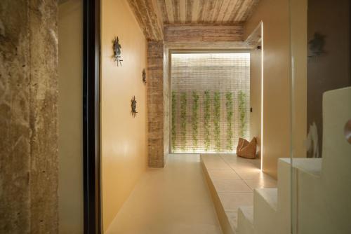 a hallway with a large window in a house at Turtle Home in Skala