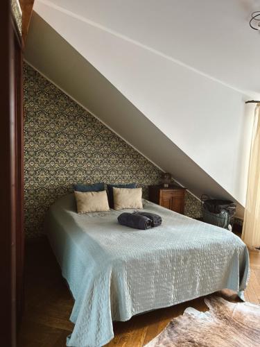 a bedroom with a bed with at Karja Castle Apartments in Haapsalu