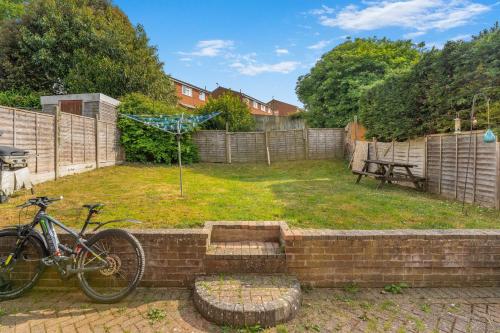 a bike is parked in a yard at Badger Haven, Apartment 3 in Brackley