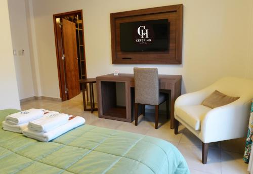 Postel nebo postele na pokoji v ubytování Ceferino Hotel
