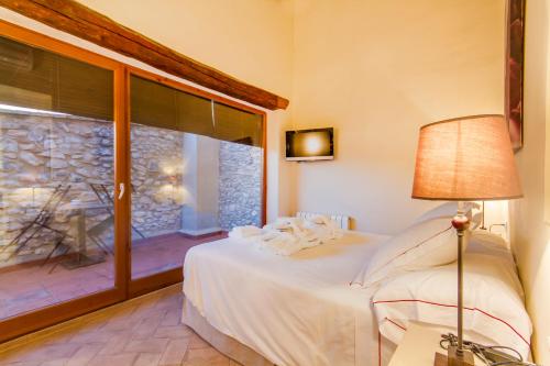 Postel nebo postele na pokoji v ubytování Hotel Rural Cal Torner Adults Only