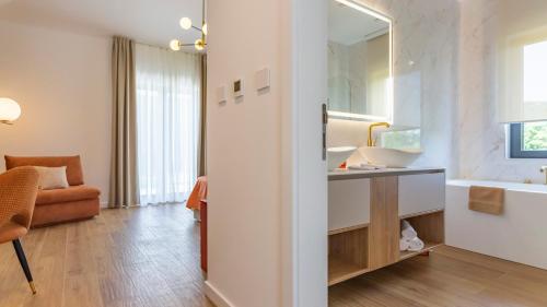 a bathroom with a sink and a mirror at Villa Decima near Split - Heated Pool, Tennis Court & Billiards in Dicmo