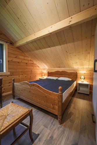 a bedroom with a bed in a attic at Gites de la Semois in Laviot