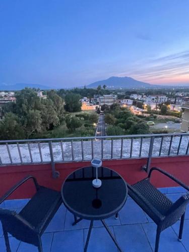 a table and chairs on a balcony with a view at Bellosguardo Suites in San Paolo Bel Sito