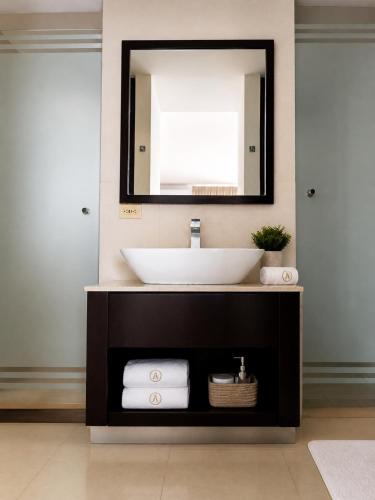 a bathroom with a sink and a mirror at Blue Diamond Suite de playa in Playa Blanca