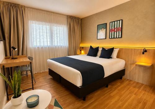a hotel room with a bed and a desk at Los Patios de Julia by DOT Boutique in Buenos Aires