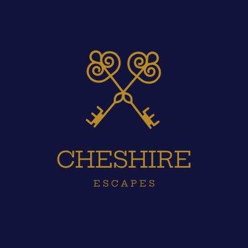 a logo for a store with a pair of scissors at Greenfields Apartment in Chester