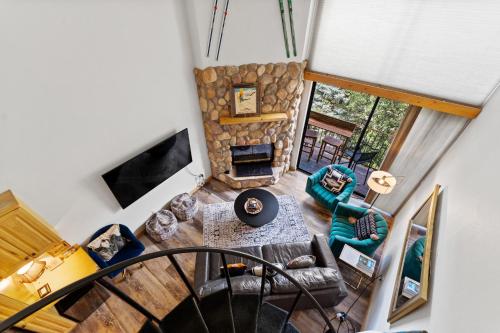 an overhead view of a living room with a stone fireplace at Summit House East #313 in Copper Mountain