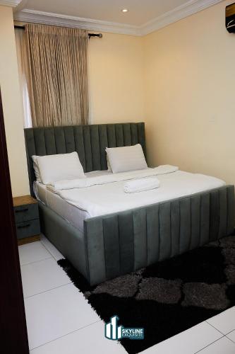 a bed in a room with a large mattress at Skyline Exquisite in Araromi