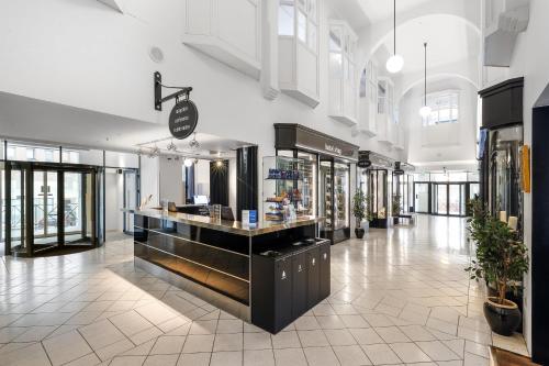 a store with a counter in the middle of a building at Best Western ToRVEhallerne in Vejle