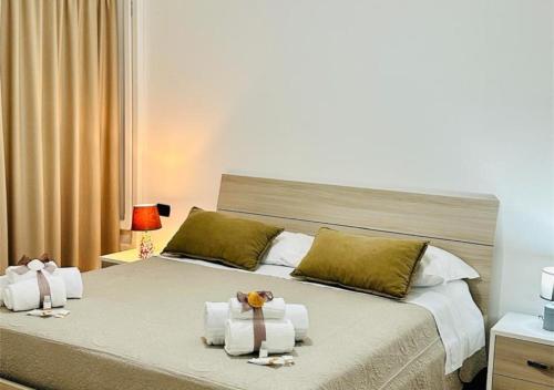 a bedroom with a bed with towels on it at View Ischia & Procida -Villa Lamberti Casa Panorama in Monte di Procida