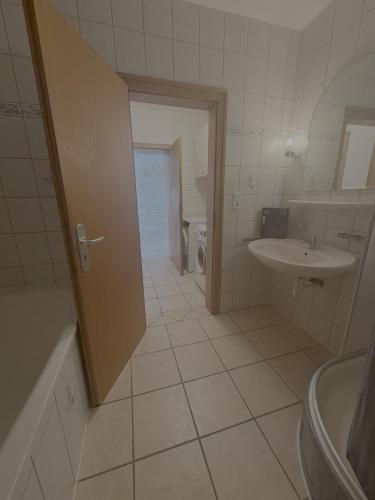 a bathroom with a tub and a sink and a toilet at Apartment Wesel in Wesel