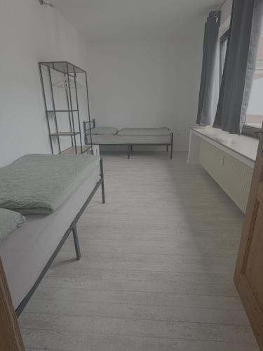 a bedroom with two beds and two windows at Apartment Wesel in Wesel