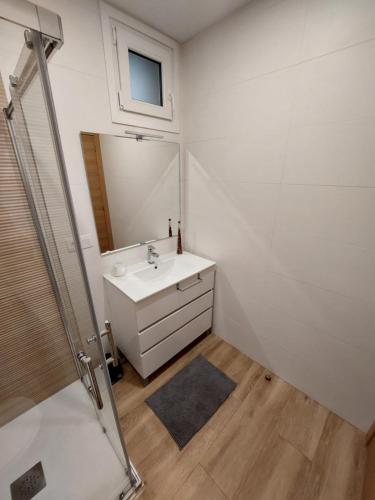 a bathroom with a sink and a mirror at Casa MENDEZ - ALLARIZ in Ourense