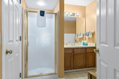 a bathroom with a shower and a sink at 110 Pointes North Inn in Charlevoix