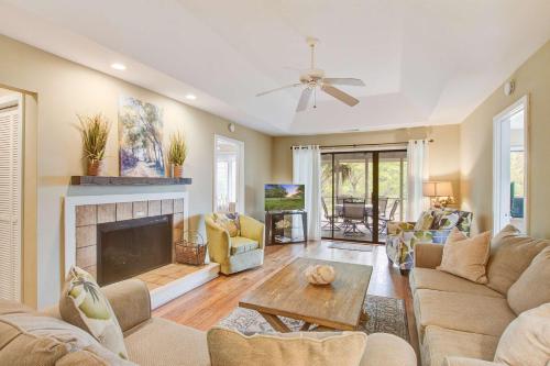 a living room with a couch and a fireplace at Inlet Cove 94 in Kiawah Island