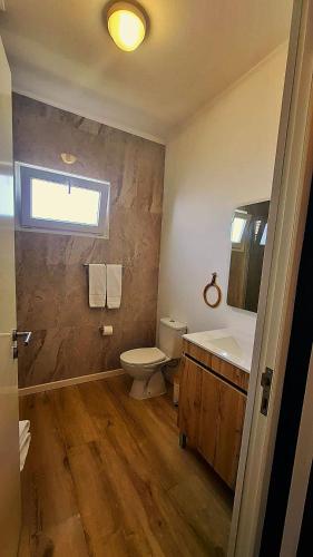 a bathroom with a toilet and a sink at Farol Guesthouse in Angra do Heroísmo