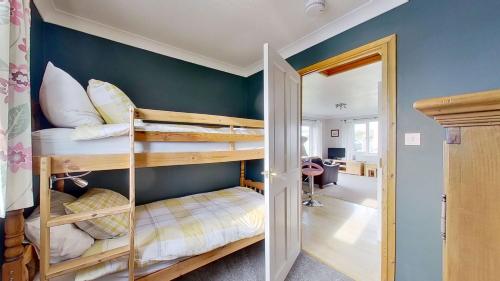 a couple of bunk beds in a room at F72 Chyreden, Riviere Towans in Hayle