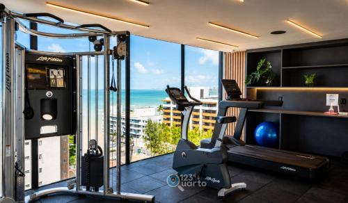 a gym with a view of the ocean at Emunah by 123Quarto in Camalaú