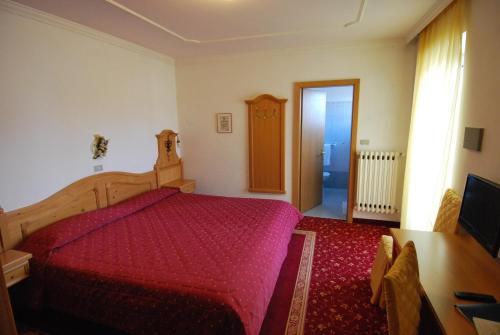 Postel nebo postele na pokoji v ubytování Hotel Belvedere Srl