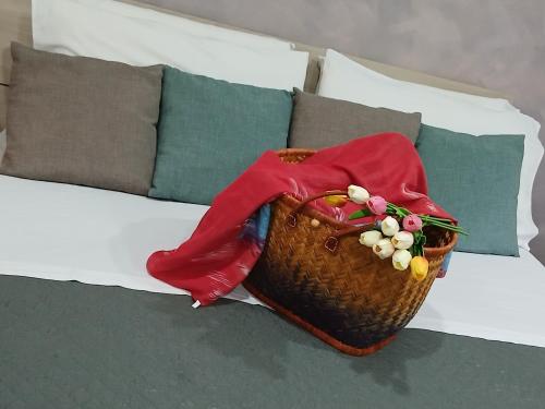 a basket sitting on top of a bed at La Dimora Di Bruna in Naples