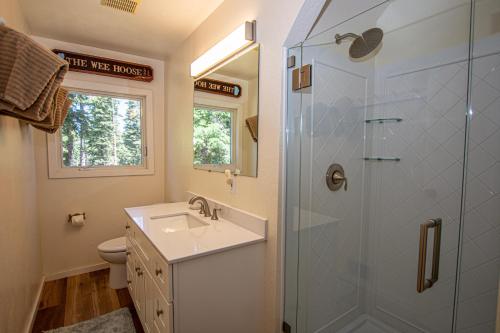 a bathroom with a sink and a shower at Hillhouse By Hauserman Rentals in Homewood