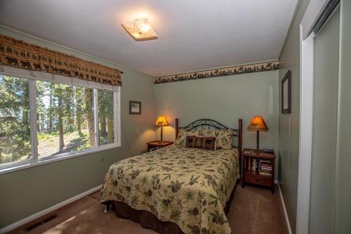 a bedroom with a bed and a window at Holland By Hauserman Rentals in Homewood