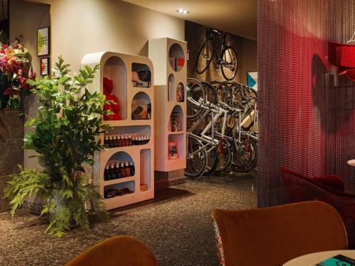 a room with a wine cellar with bikes on the wall at 25hours Hotel The Goldman in Frankfurt