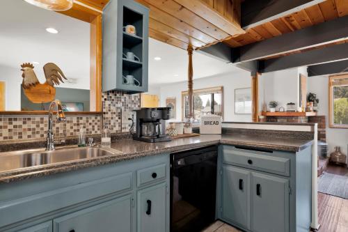 a kitchen with a sink and a counter top at Big Bear Bungalow #643 in Big Bear City