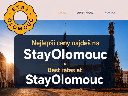 a sign with a doughnut on top of a building at Old Town Studio - Stay Olomouc CZ in Olomouc