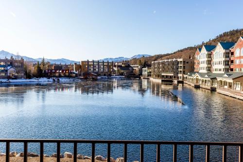 a river in a city with buildings and houses at Willows #1713 in Keystone