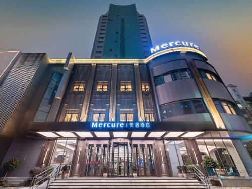 a large building with a mexicoribune building at Mercure Ningbo Yinzhou in Ningbo