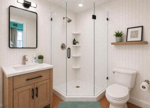 a bathroom with a shower with a toilet and a sink at East End Escape in Christiansted