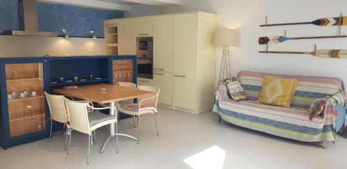 a bedroom with a table and a bed and a table and chairs at Calella-Port Bo · Sun Sea Unique Character in Calella de Palafrugell