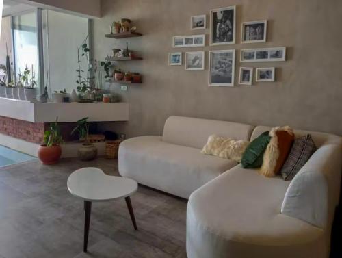 a living room with a white couch and a table at Spacious 4BR Duplex with Pool in Punta Hermosa in Punta Hermosa