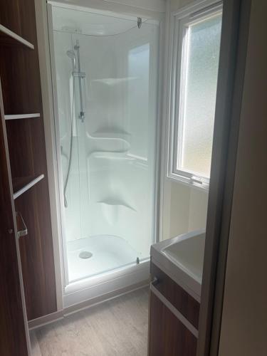 a bathroom with a shower and a sink at camping des iscles 167 in La Roque-dʼAnthéron