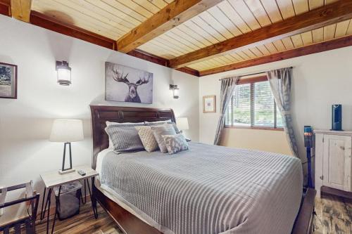 a bedroom with a large bed and a window at The Music Chalet in Ronald
