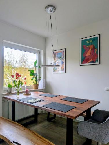 a wooden table in a room with a window at Basislager Rheinsteig in Bad Hönningen