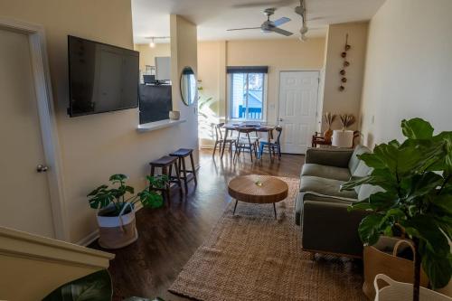 a living room with a couch and a table at Bucktown Private Condo in Chicago