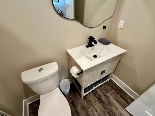 a bathroom with a white toilet and a sink at River Stone Villa - 2Bedroom/2Bath - No Step Entry in Bellevue