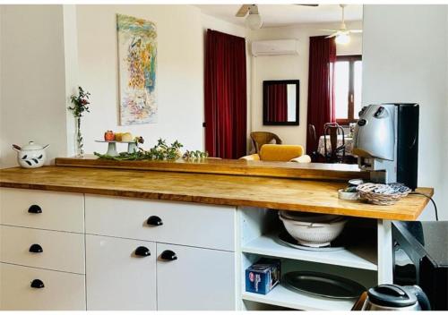 a kitchen with a counter top with aounter at Near Acquamorta Beach - Villa Lamberti Casa Sole in Monte di Procida