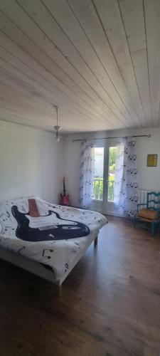 a bedroom with a large bed in a room at Chambres d hôtes Avalanche du rock in Buzy