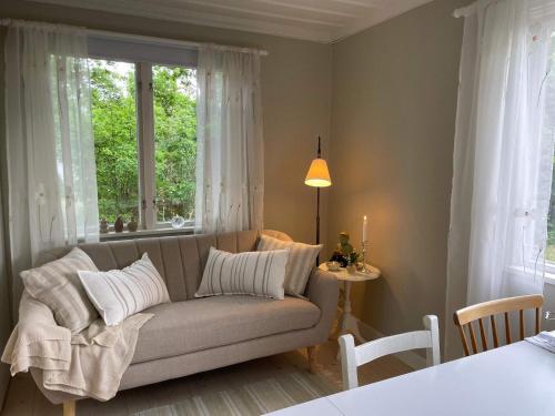 a living room with a couch and a window at 6 person holiday home in 38472-By Traum in Tillingenabben