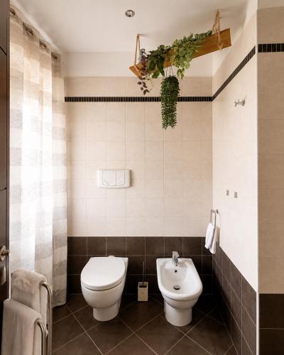 a bathroom with a toilet and a sink at Stile e comfort! in Trecate