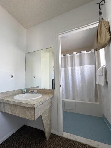 a bathroom with a sink and a mirror at The Jetty Motel in Cape May