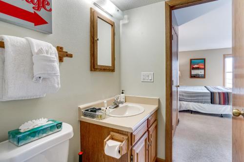 a bathroom with a sink and a toilet at Silverthorne Condo: New Pool & Hot Tub + Fireplace in Silverthorne