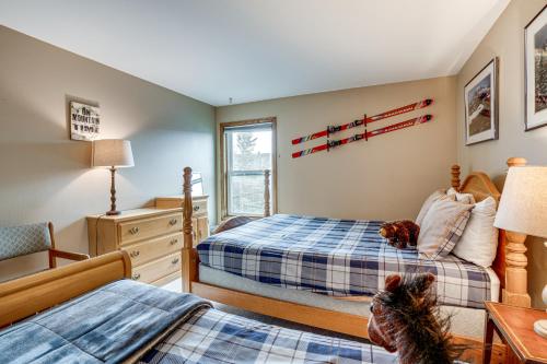 a bedroom with two beds and a desk at Silverthorne Condo: New Pool & Hot Tub + Fireplace in Silverthorne