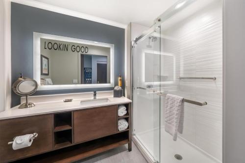 a bathroom with a sink and a shower at Best Western Plus Rialto in Rialto
