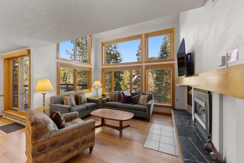 a living room filled with furniture and a fireplace at Quicksilver #1631 in Keystone